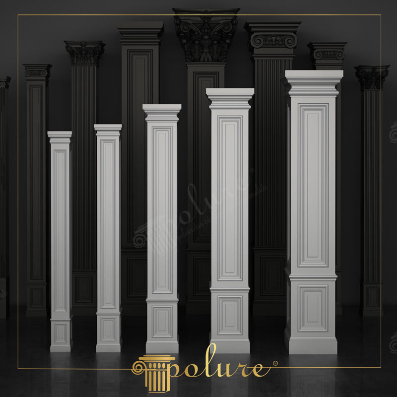 Karanlık bir stüdyoda yan yana dizilmiş beyaz poliüretan pilaster sütun serisi ve arkada antrasit renkli dekoratif sütun modelleri.